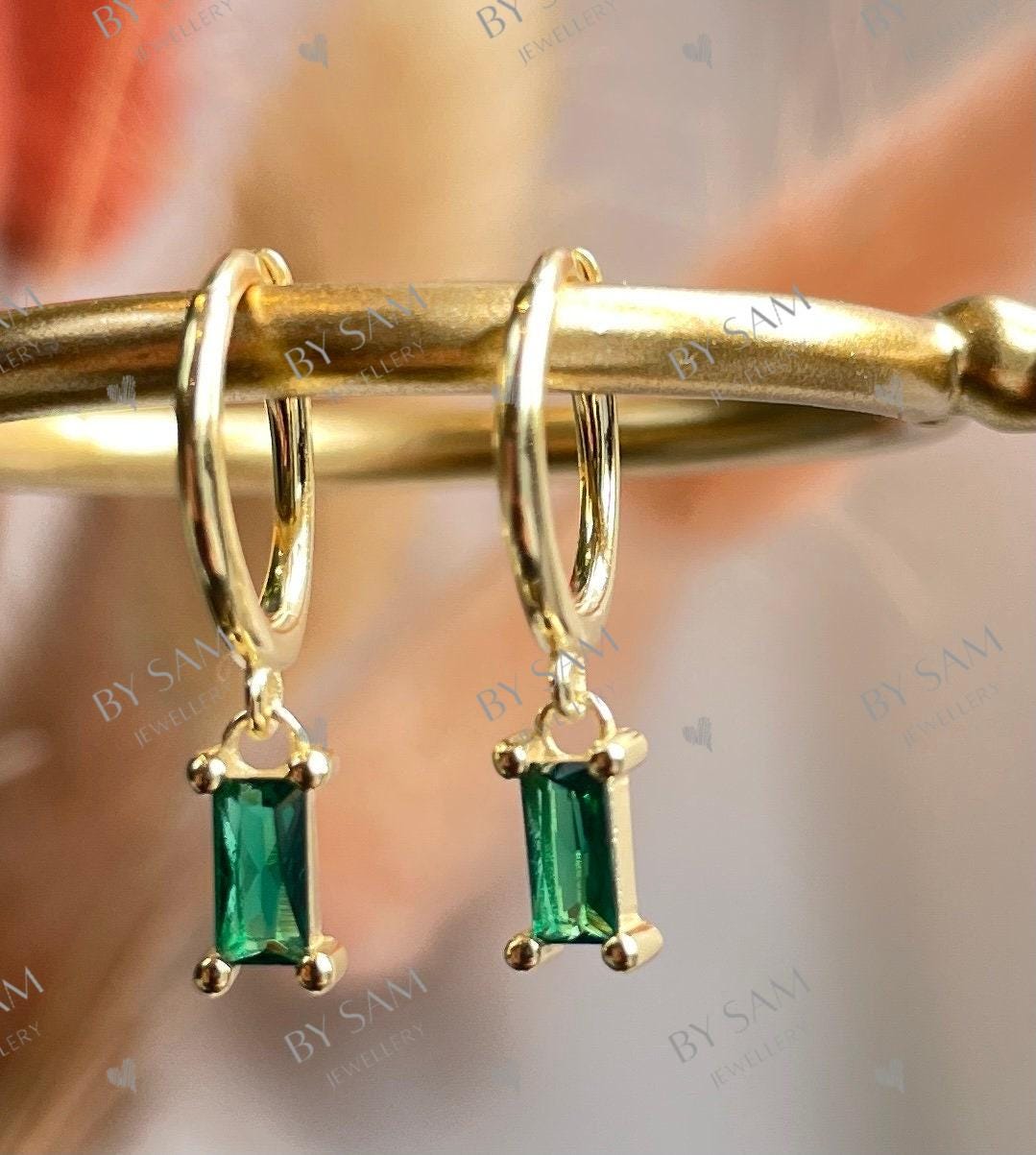 Emerald huggie earrings